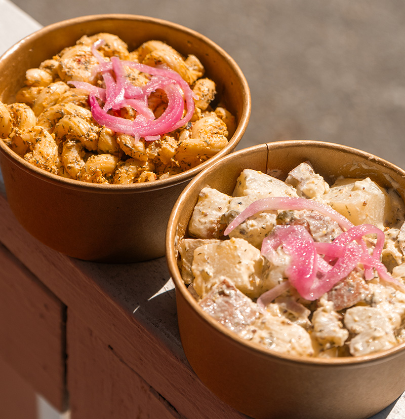 A side of potato salad and pimento mac salad.